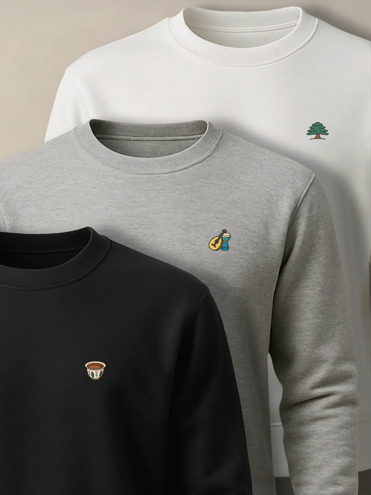 White, Gray and black sweatshirts with the Cedar, Music Duo and Lebanese Coffee designs for the Lebanon Minis collection by inspire.inc