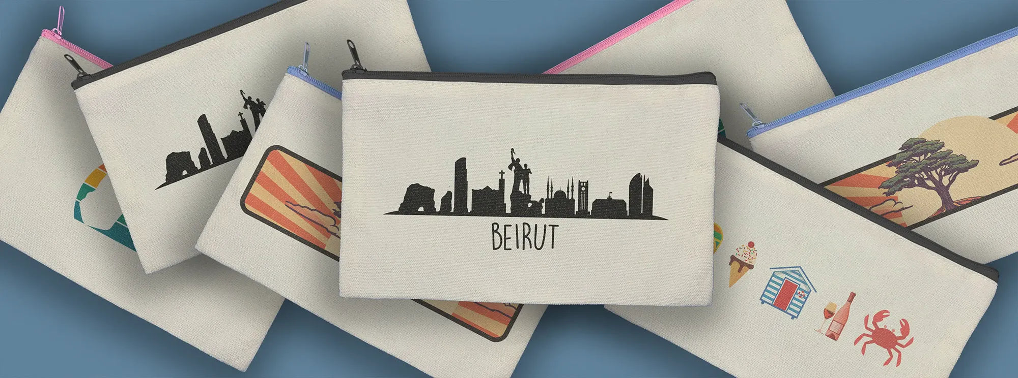 Multiple designs on zipper pouches with the Beirut Skyline design at the center by inspire.inc