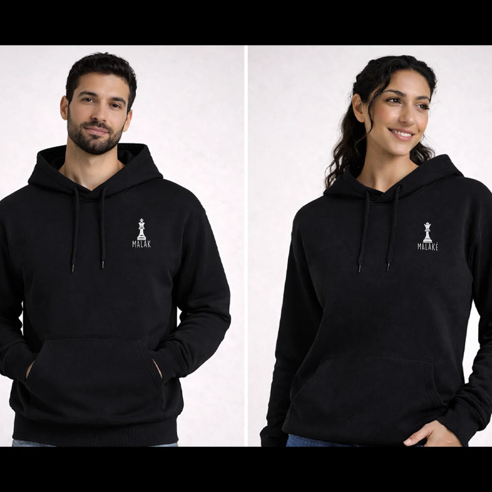 Two people wearing black hoodies from the Kings and Queens collection by inspire.inc